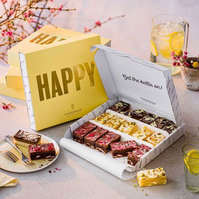image of selection box delivery of white chocolate brownie, raspberry chocolate brownie and caramel shortbread